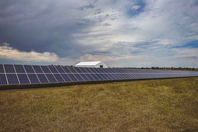 Ground-mounted solar array in an open field