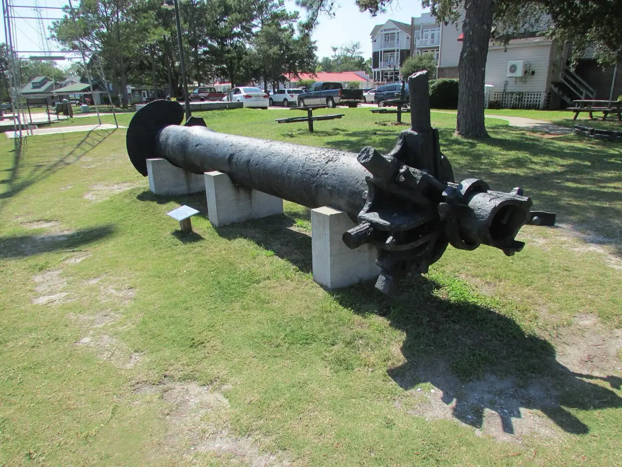 Original iron screw pile from the Roanoke Marshes Lighthouse displayed on concrete blocks in Manteo, North Carolina